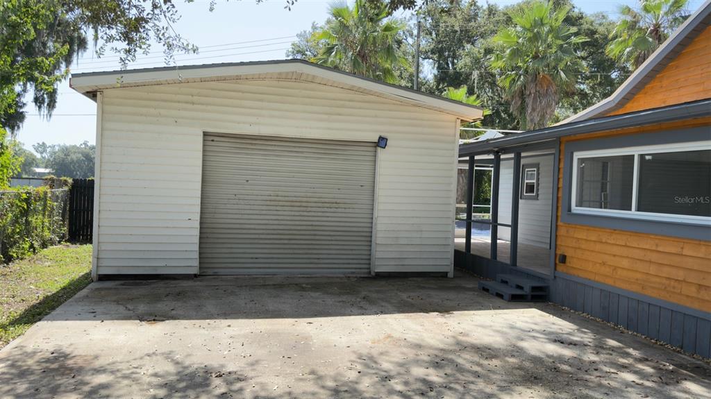 14740 Johns Road Dade City, FL 33525 - Photo 46 of 46 a view of a small house with wooden fence