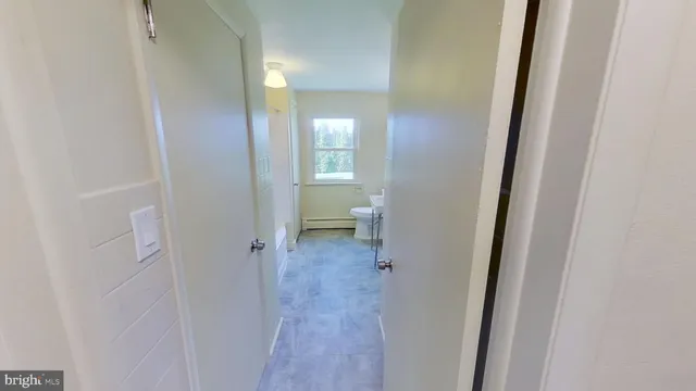 a view of a bathroom from the hallway