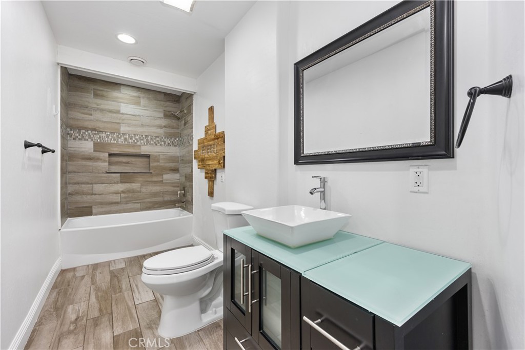 29300 Elkhorn Place Tehachapi, CA 93561 - Photo 26 of 47 a bathroom with a toilet sink and mirror