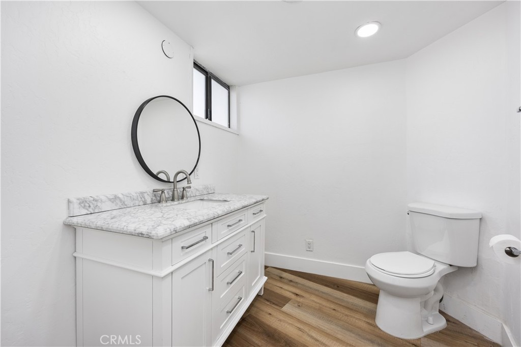29300 Elkhorn Place Tehachapi, CA 93561 - Photo 29 of 47 a bathroom with a toilet sink and mirror