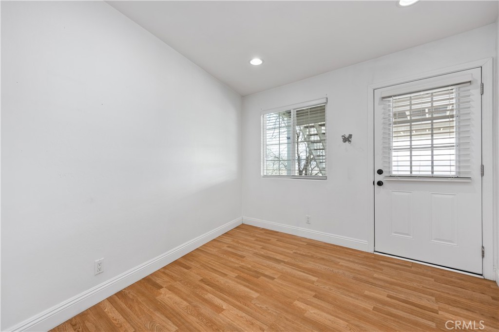 29300 Elkhorn Place Tehachapi, CA 93561 - Photo 34 of 47 an empty room with wooden floor and windows