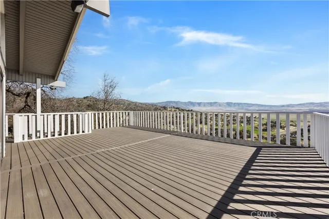 a view of balcony with wooden floor