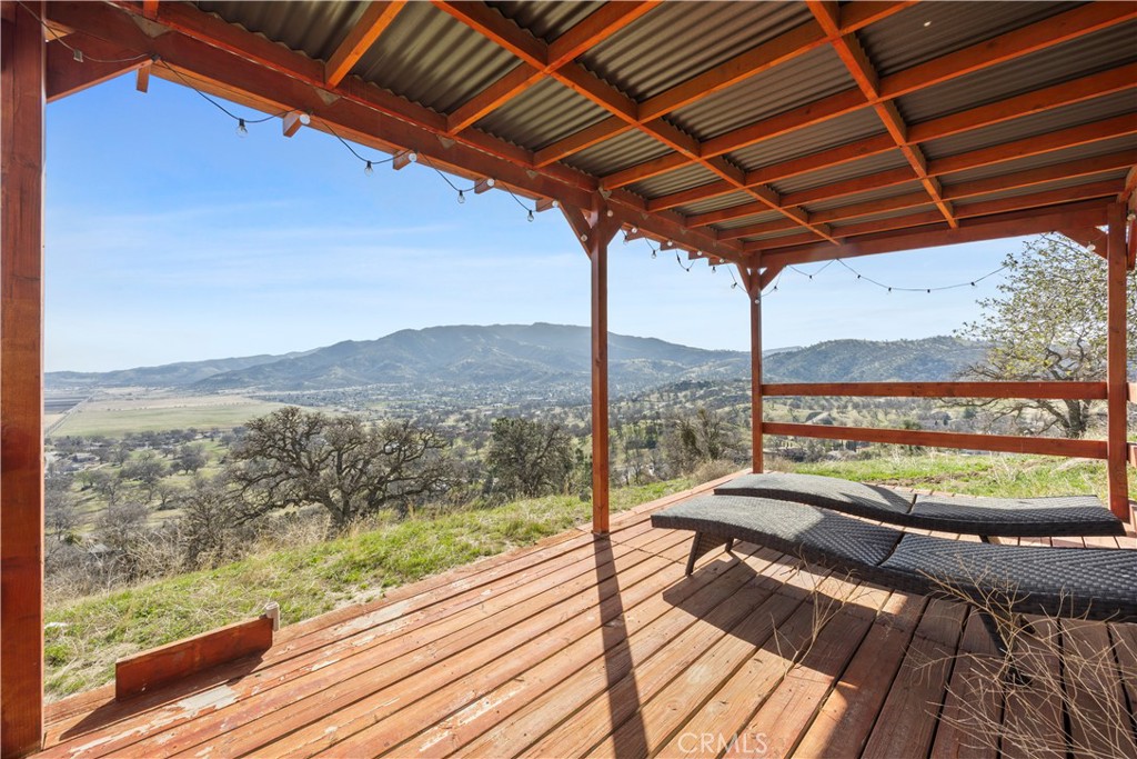 29300 Elkhorn Place Tehachapi, CA 93561 - Photo 46 of 47 a view of a balcony with furniture and wooden floor