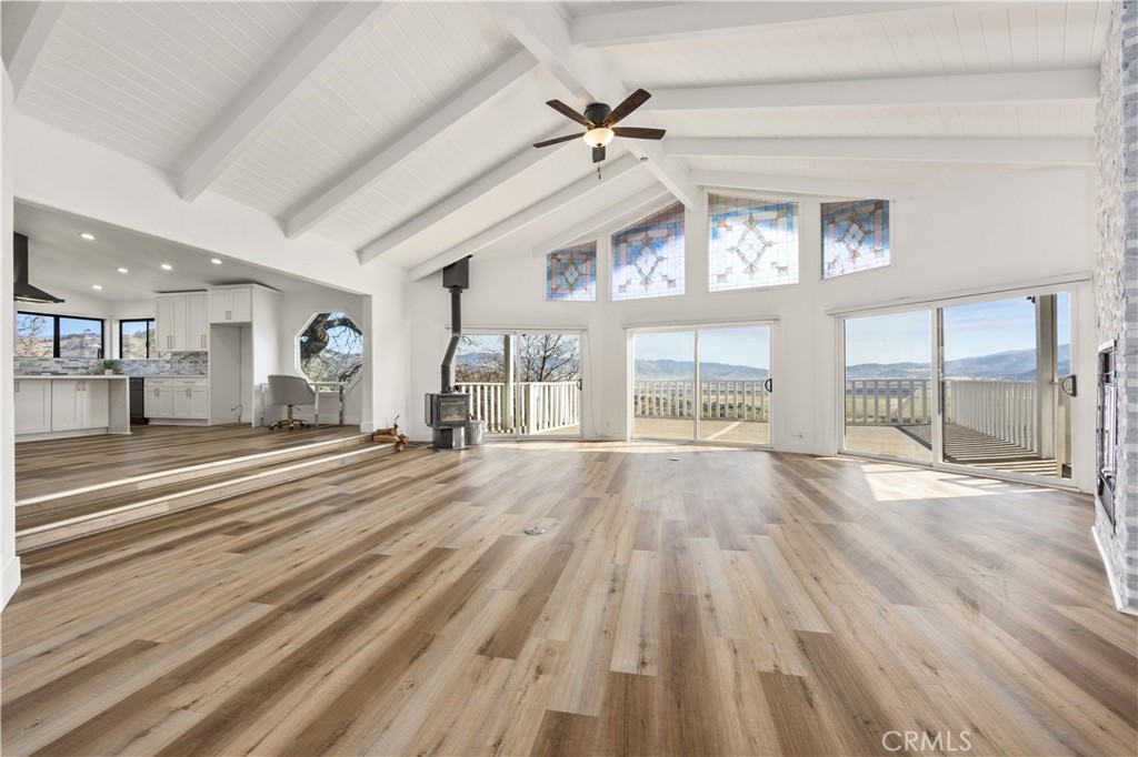 29300 Elkhorn Place Tehachapi, CA 93561 - Photo 9 of 47 a view of an empty room with wooden floor and a window