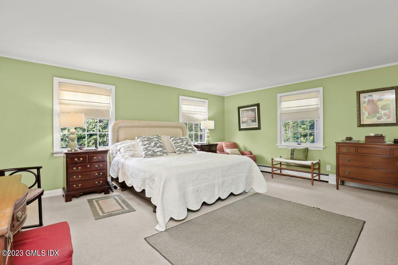 14 Marks Road Riverside, CT 06878 - Photo 13 of 24 a bedroom with a bed and a dresser next to a window