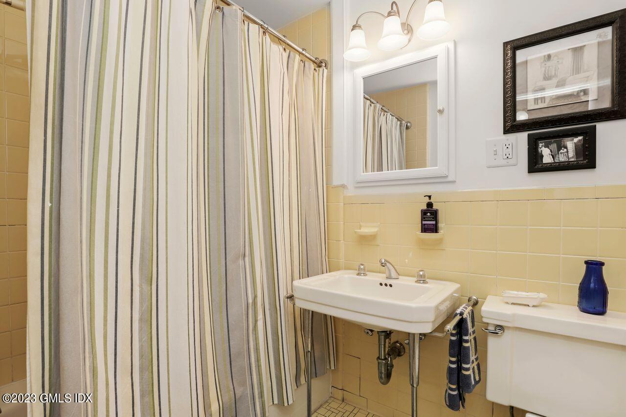 14 Marks Road Riverside, CT 06878 - Photo 15 of 24 a bathroom with a sink and a mirror