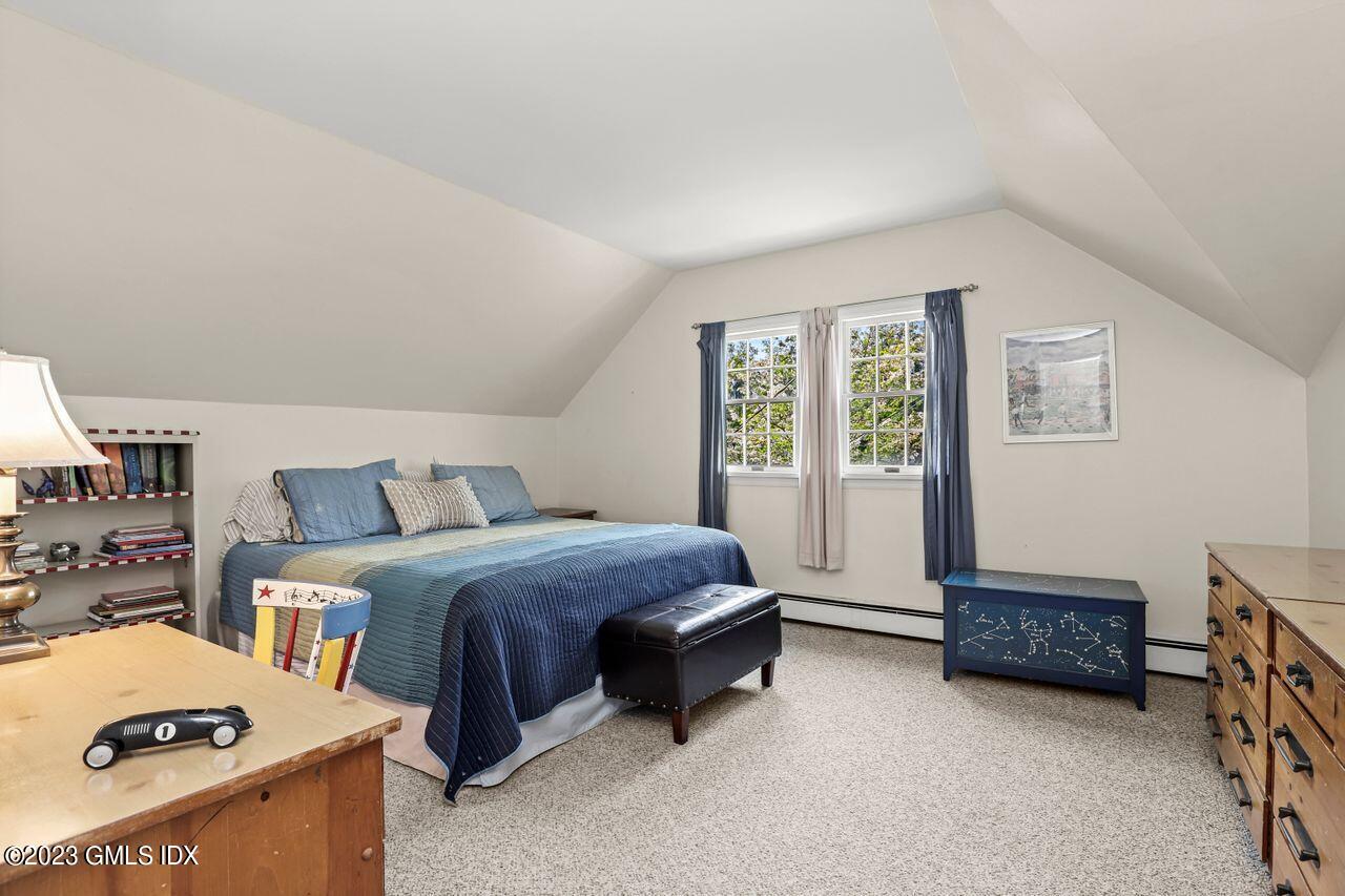 14 Marks Road Riverside, CT 06878 - Photo 16 of 24 a spacious bedroom with a bed and a window