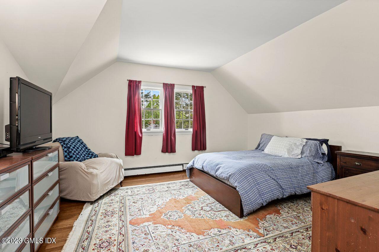 14 Marks Road Riverside, CT 06878 - Photo 17 of 24 a bedroom with a bed and wooden floor