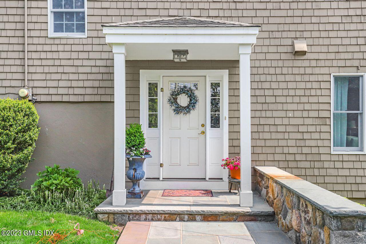 14 Marks Road Riverside, CT 06878 - Photo 6 of 24 a front view of a house with a garage