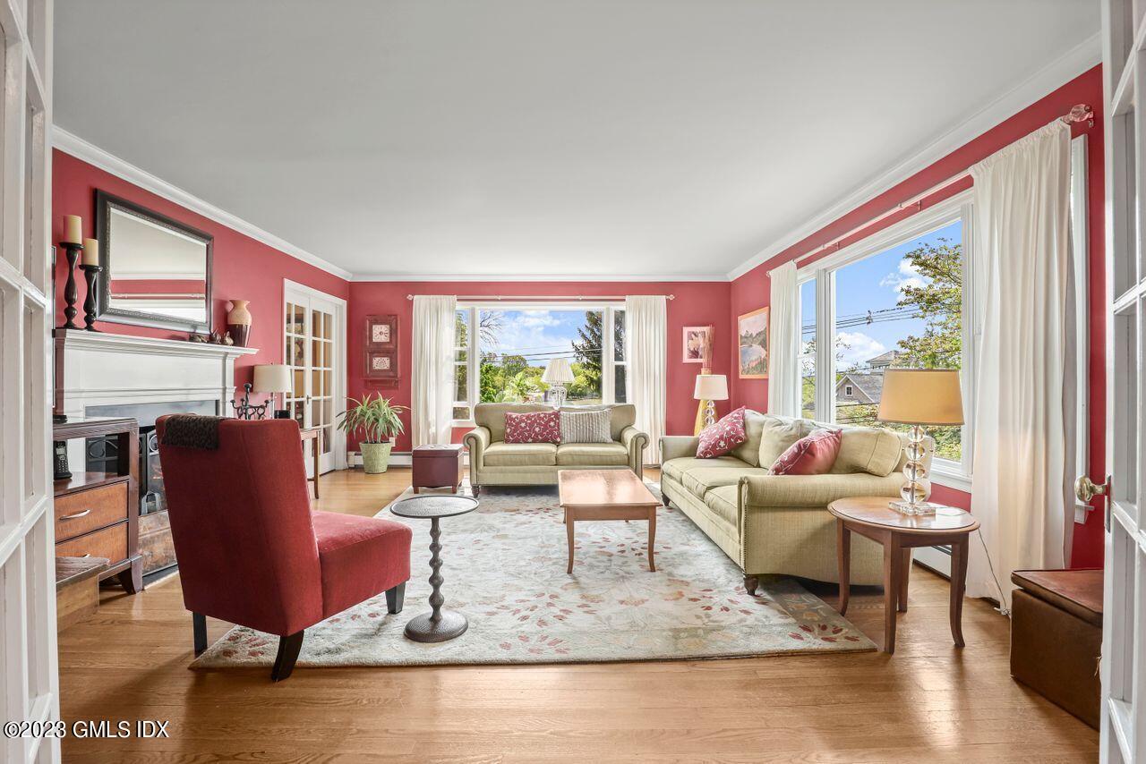 14 Marks Road Riverside, CT 06878 - Photo 8 of 24 a living room with fireplace furniture and a large window
