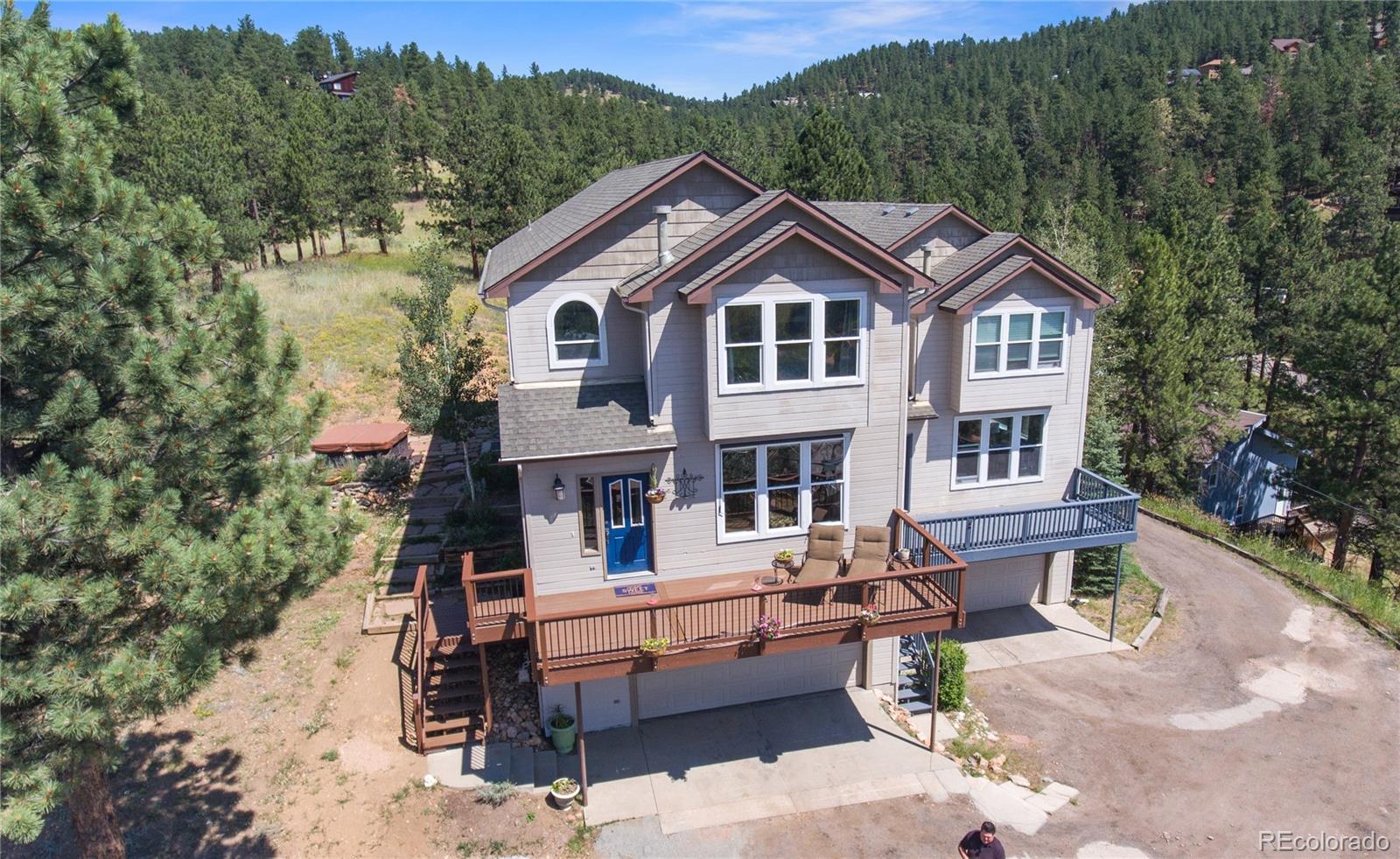 3345 Russell Gulch Road, Unit A Evergreen, CO 80439 - Photo 1 of 34 a aerial view of a house with a yard