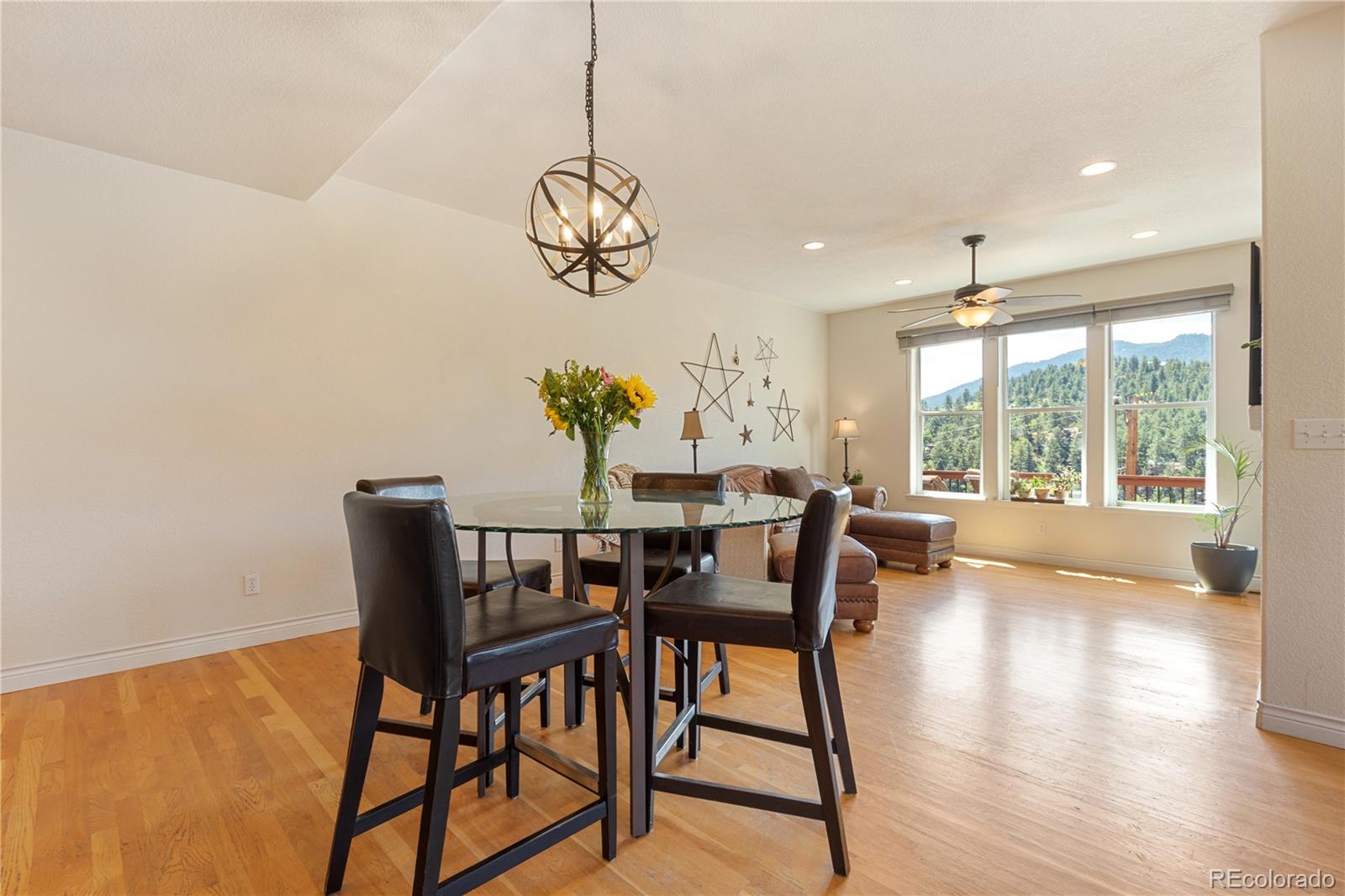 3345 Russell Gulch Road, Unit A Evergreen, CO 80439 - Photo 13 of 34 a view of a dining room with furniture window and outside view
