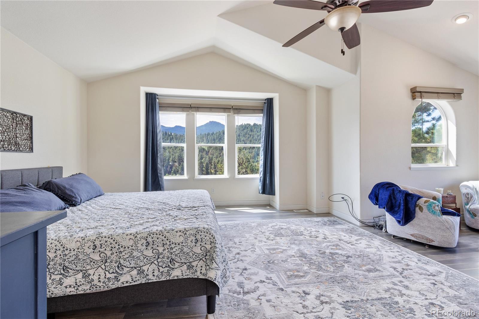 3345 Russell Gulch Road, Unit A Evergreen, CO 80439 - Photo 18 of 34 a bedroom with a bed and window