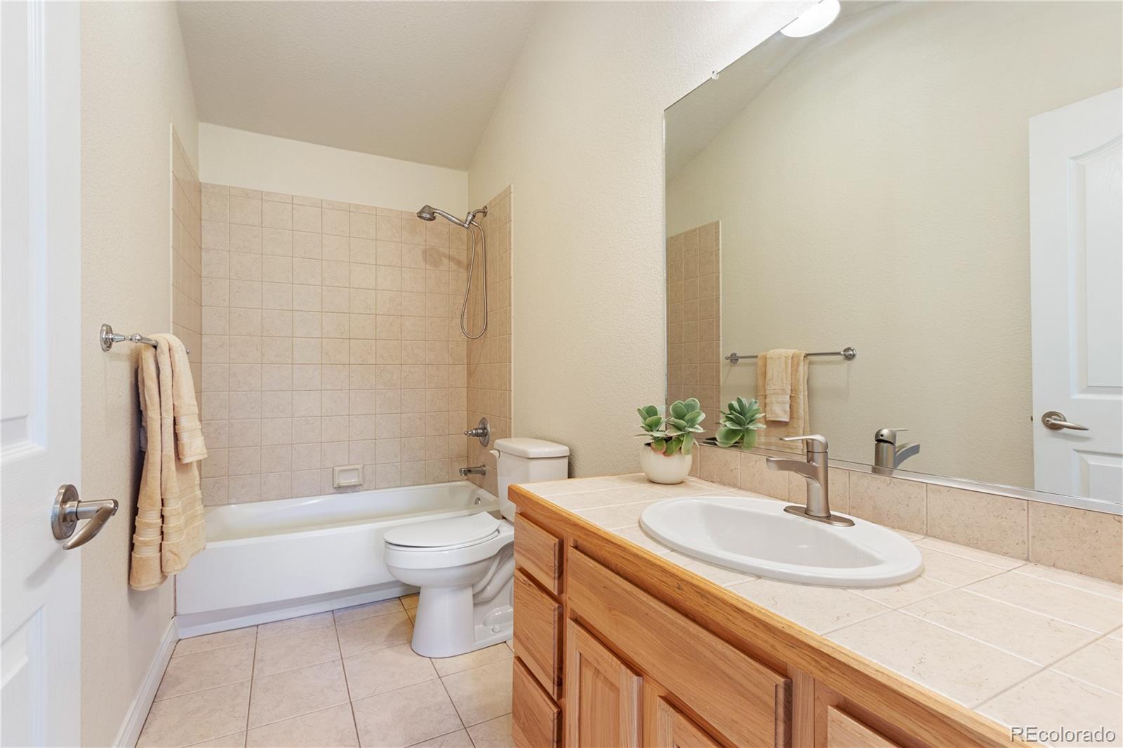 3345 Russell Gulch Road, Unit A Evergreen, CO 80439 - Photo 24 of 34 a bathroom with a sink a toilet and shower