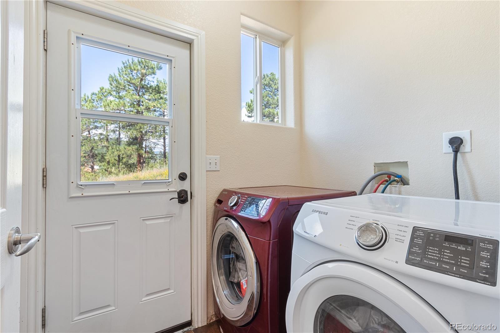 3345 Russell Gulch Road, Unit A Evergreen, CO 80439 - Photo 28 of 34 a utility room with dryer and washer