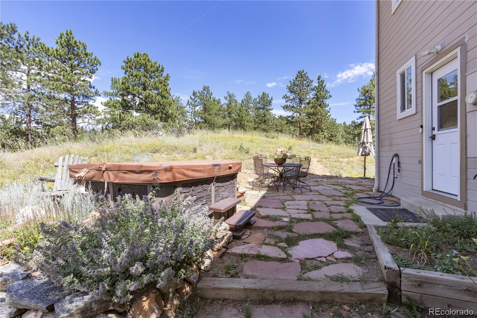 3345 Russell Gulch Road, Unit A Evergreen, CO 80439 - Photo 29 of 34 a view of a water pond with an outdoor seating