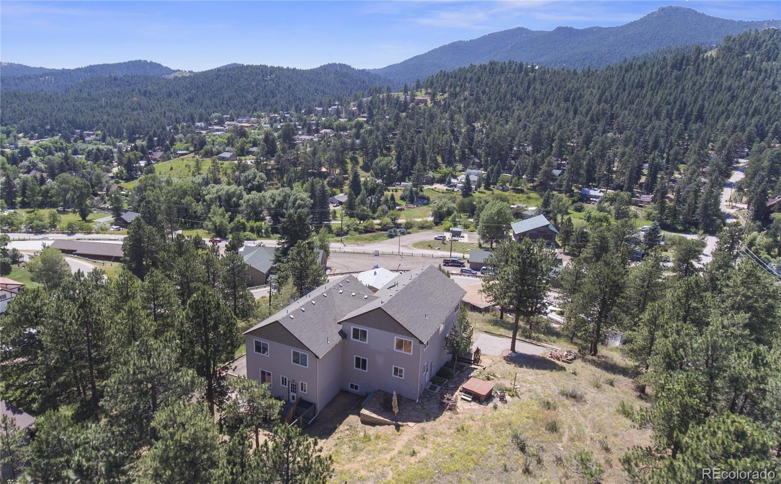 3345 Russell Gulch Road, Unit A Evergreen, CO 80439 - Photo 34 of 34 an aerial view of a house with a mountain in the background