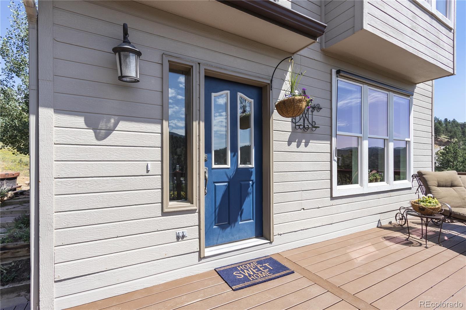 3345 Russell Gulch Road, Unit A Evergreen, CO 80439 - Photo 7 of 34 a view of a door and chair in the balcony