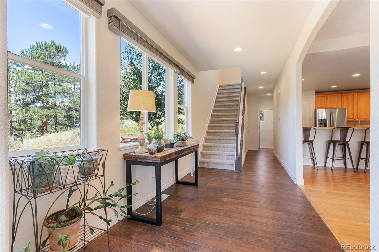 3345 Russell Gulch Road, Unit A Evergreen, CO 80439 - Photo 9 of 34 a view of a room with furniture and wooden floor