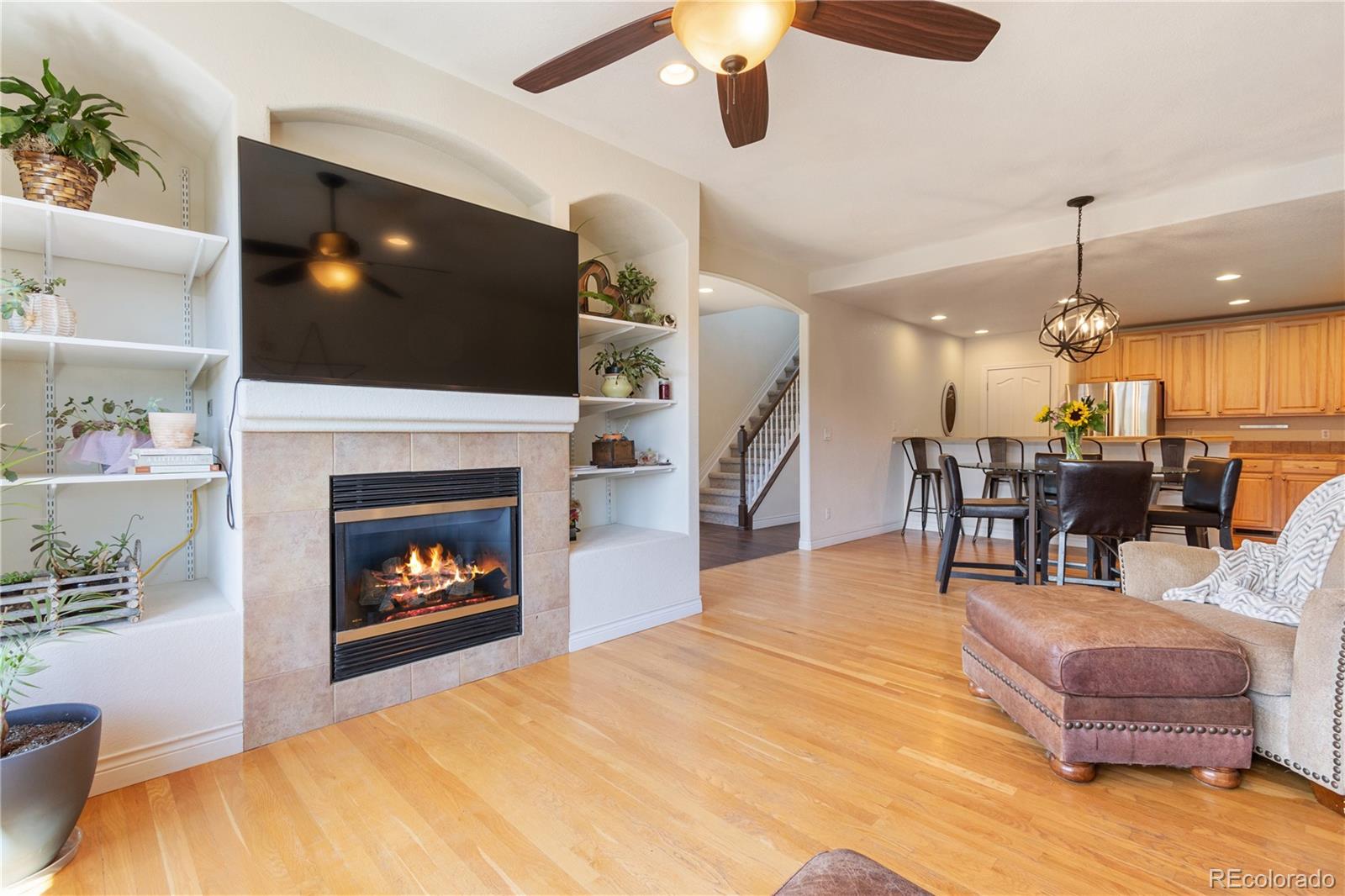3345 Russell Gulch Road, Unit A Evergreen, CO 80439 - Photo 10 of 34 a living room with furniture a flat screen tv and a fireplace
