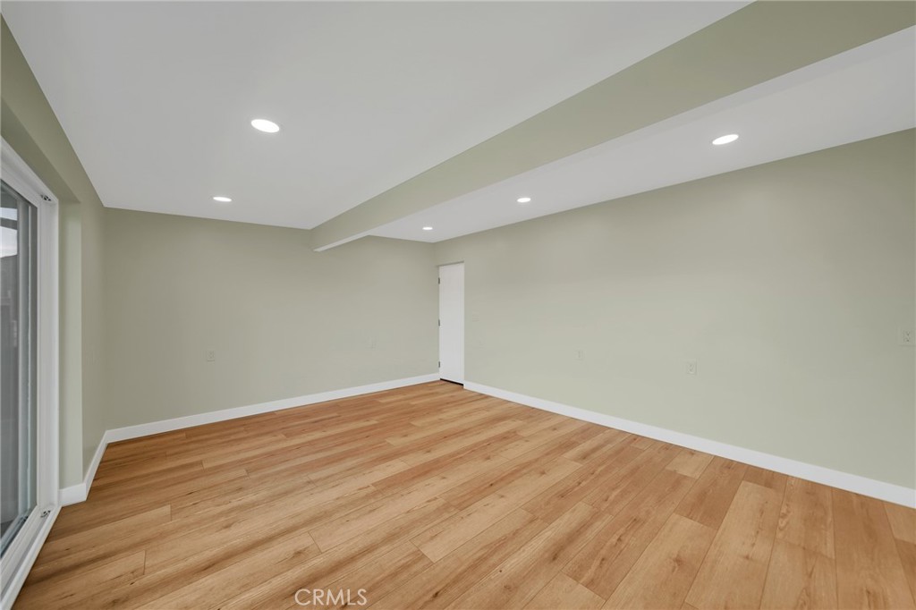25251 Tuna Drive Dana Point, CA 92629 - Photo 15 of 30 an empty room with wooden floor and fan
