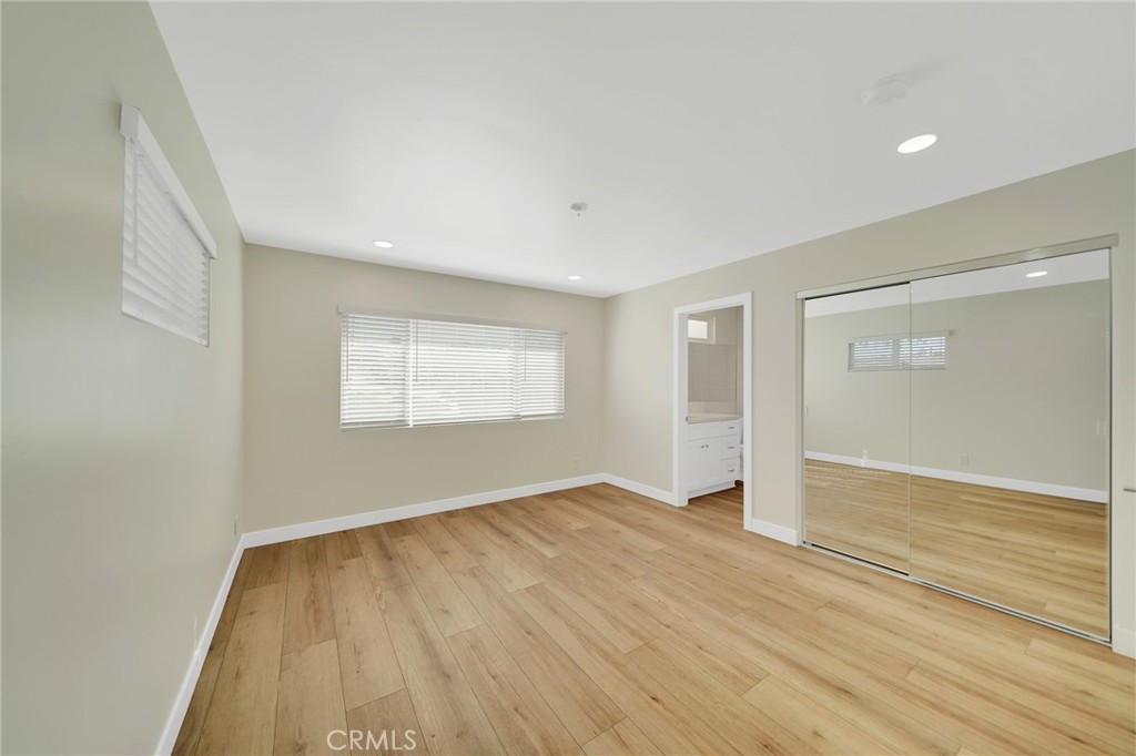25251 Tuna Drive Dana Point, CA 92629 - Photo 19 of 30 an empty room with wooden floor and windows