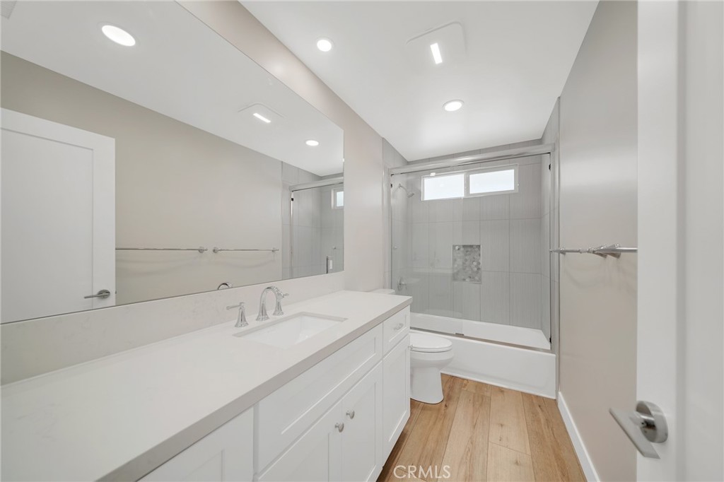 25251 Tuna Drive Dana Point, CA 92629 - Photo 20 of 30 a bathroom with a sink a toilet a shower and a mirror