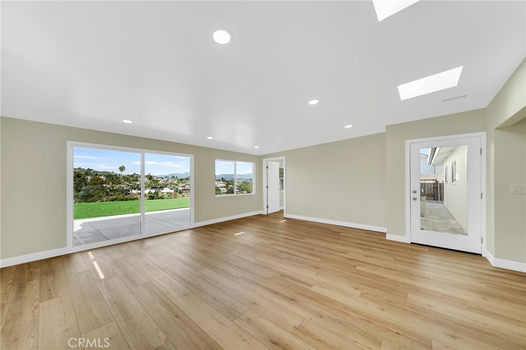 25251 Tuna Drive Dana Point, CA 92629 - Photo 7 of 30 a view of an empty room with wooden floor and a window