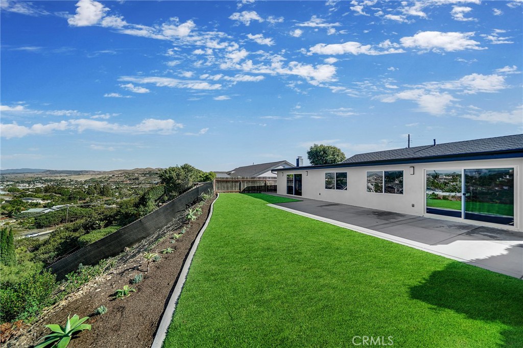 25251 Tuna Drive Dana Point, CA 92629 - Photo 8 of 30 a front view of a house with a garden and yard
