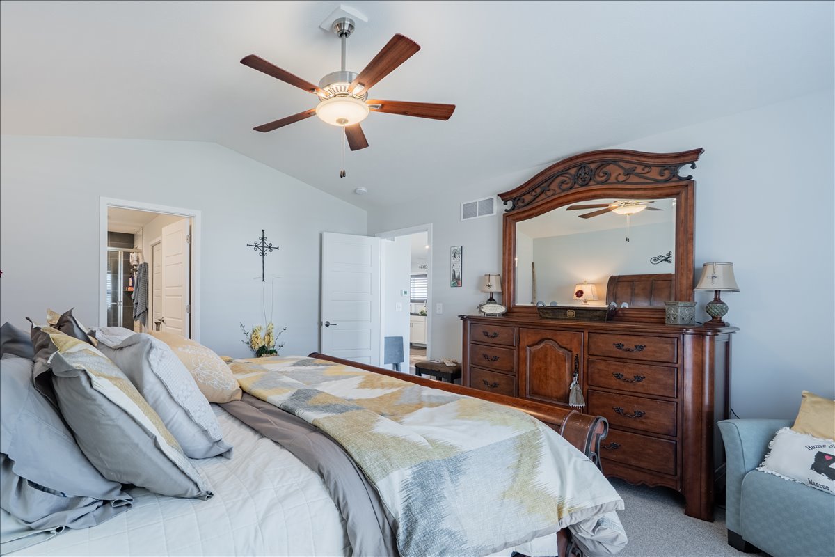 2618 Limestone Court Normal, IL 61761 - Photo 14 of 33 a bedroom with a bed and a chandelier