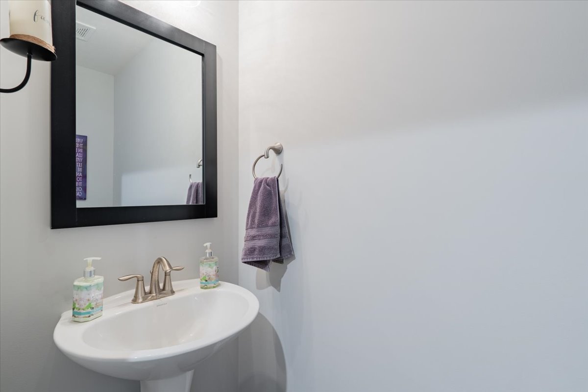 2618 Limestone Court Normal, IL 61761 - Photo 17 of 33 a bathroom with a sink and a mirror