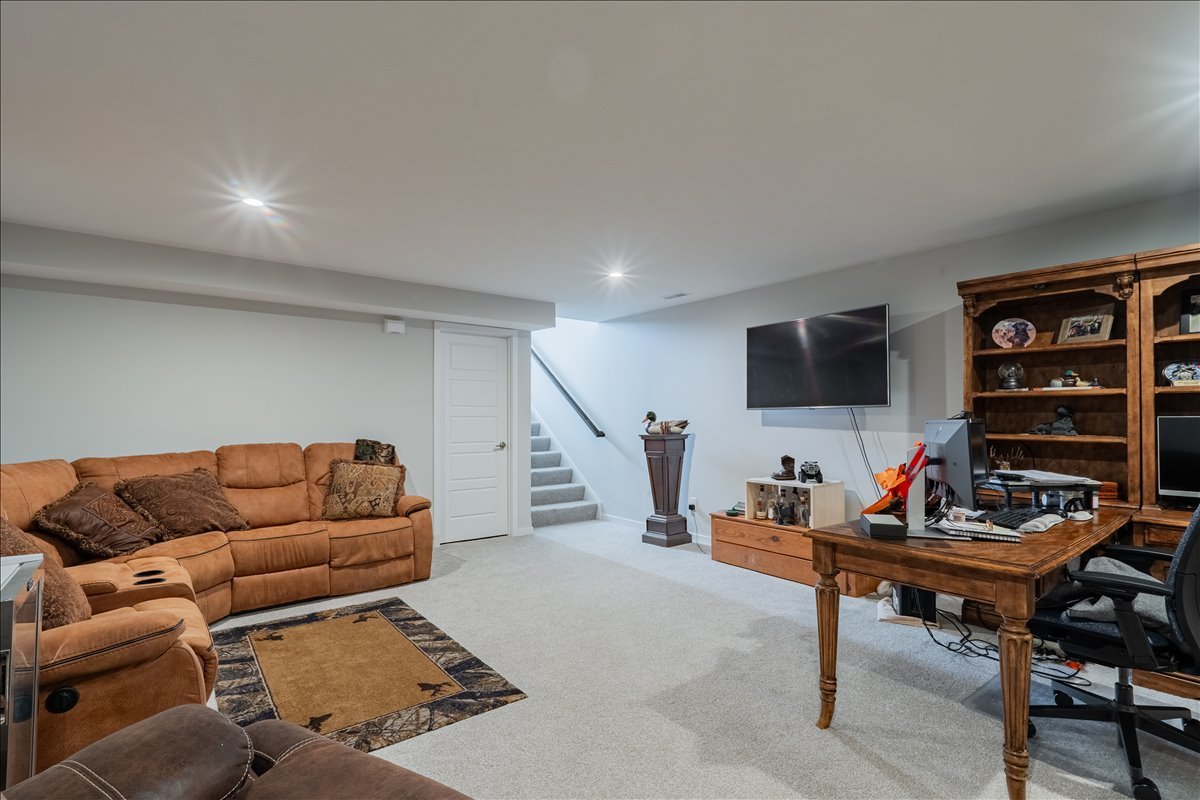 2618 Limestone Court Normal, IL 61761 - Photo 19 of 33 a living room with furniture and a flat screen tv