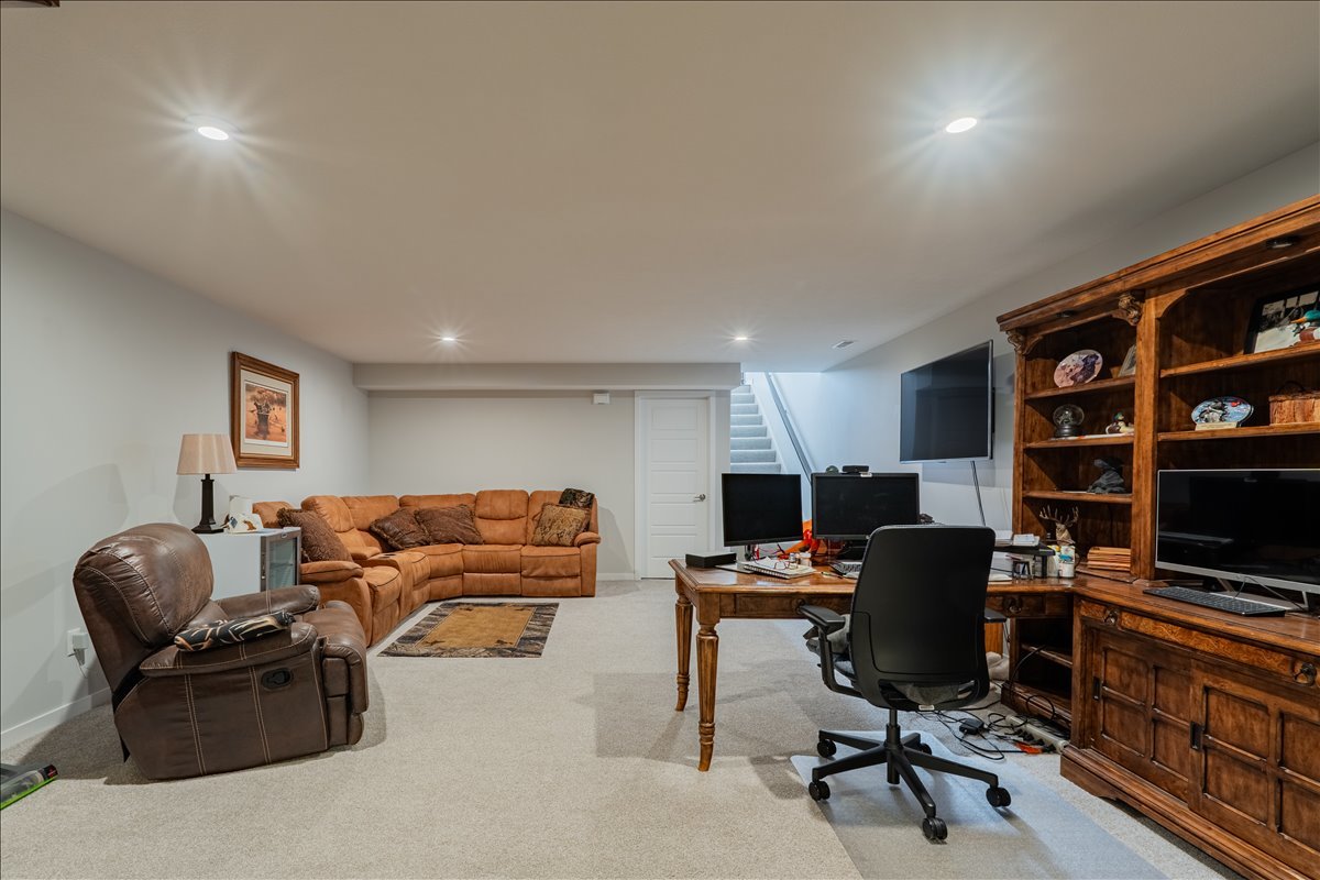 2618 Limestone Court Normal, IL 61761 - Photo 20 of 33 a livingroom with workspace and a couch
