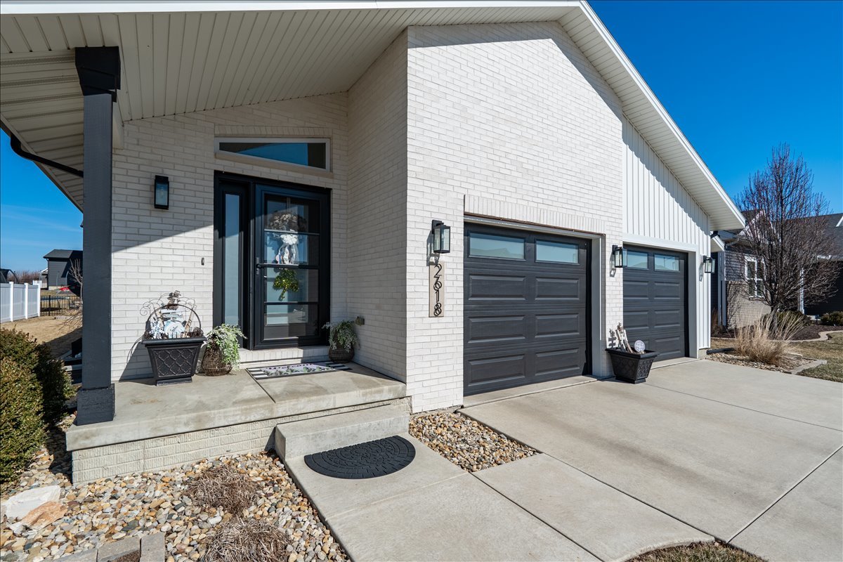 2618 Limestone Court Normal, IL 61761 - Photo 2 of 33 a view of a backyard with furniture and garage