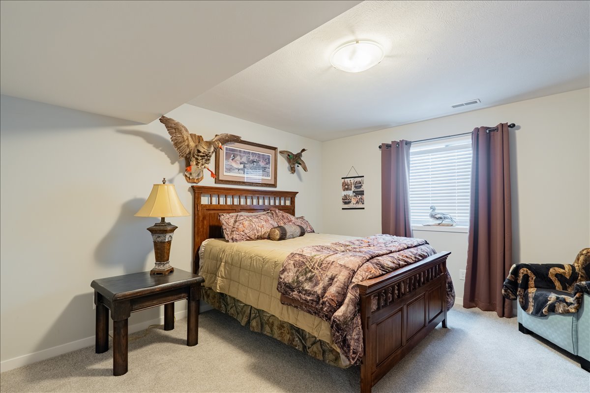 2618 Limestone Court Normal, IL 61761 - Photo 23 of 33 a bedroom with a bed and a night stand