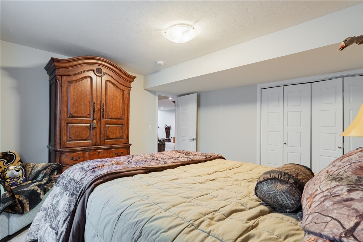 2618 Limestone Court Normal, IL 61761 - Photo 24 of 33 a bedroom with a bed and a closet