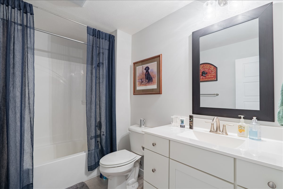 2618 Limestone Court Normal, IL 61761 - Photo 25 of 33 a bathroom with a sink a toilet a vanity and a mirror