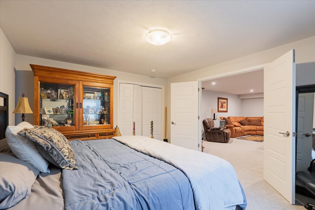 2618 Limestone Court Normal, IL 61761 - Photo 26 of 33 a bedroom with a large bed and furniture