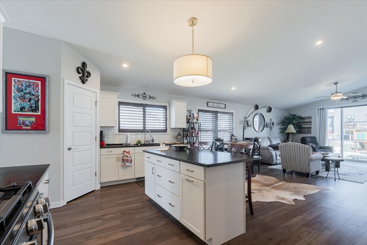 2618 Limestone Court Normal, IL 61761 - Photo 5 of 33 a kitchen with stainless steel appliances granite countertop a sink stove and wooden floor