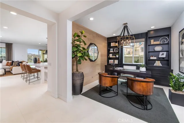 a living room with furniture a window and a table