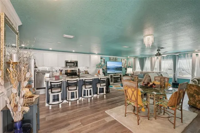 a view of a dining area with furniture window and wooden floor