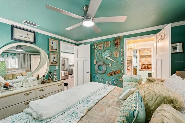 a bedroom with a large bed and a window