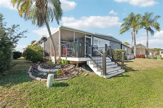 a view of a lake with boats and trees