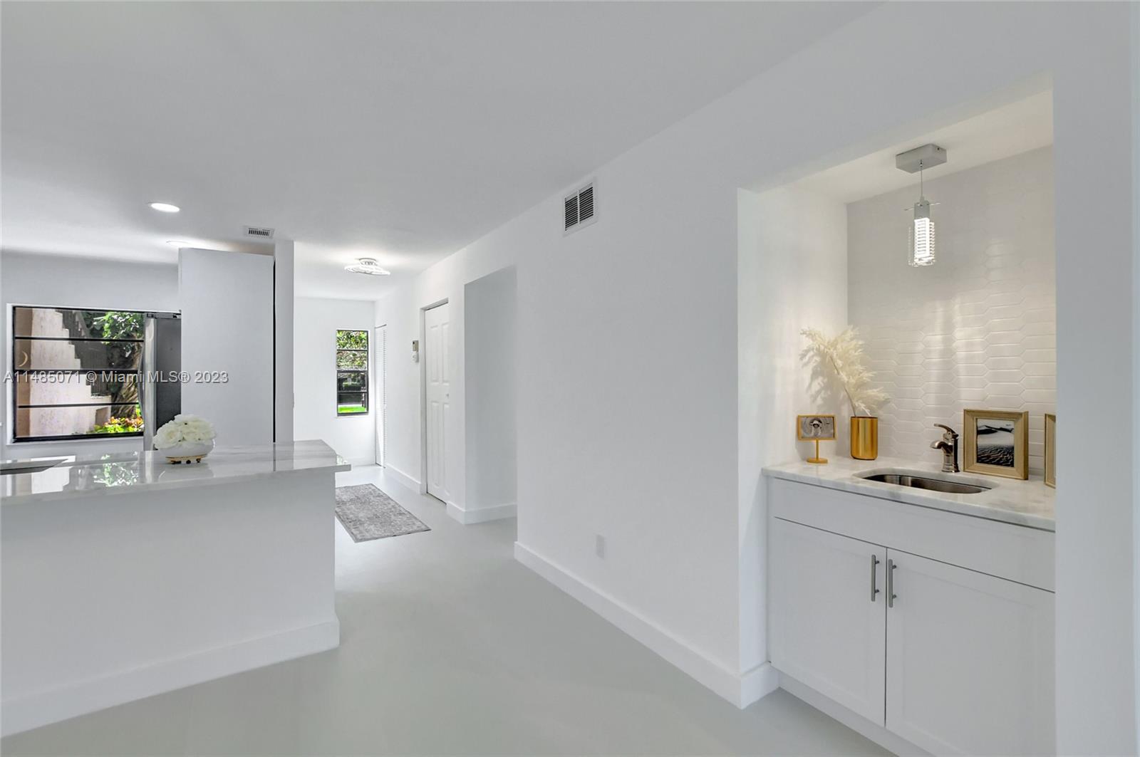 9264 Vista Del Lago, Unit E Boca Raton, FL 33428 - Photo 13 of 26 a bathroom with a sink and mirror