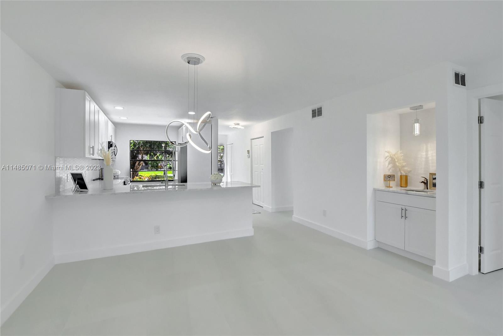 9264 Vista Del Lago, Unit E Boca Raton, FL 33428 - Photo 14 of 26 a view of a kitchen and a window