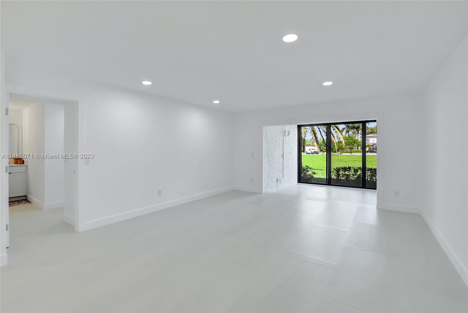 9264 Vista Del Lago, Unit E Boca Raton, FL 33428 - Photo 15 of 26 an empty room with windows and closet