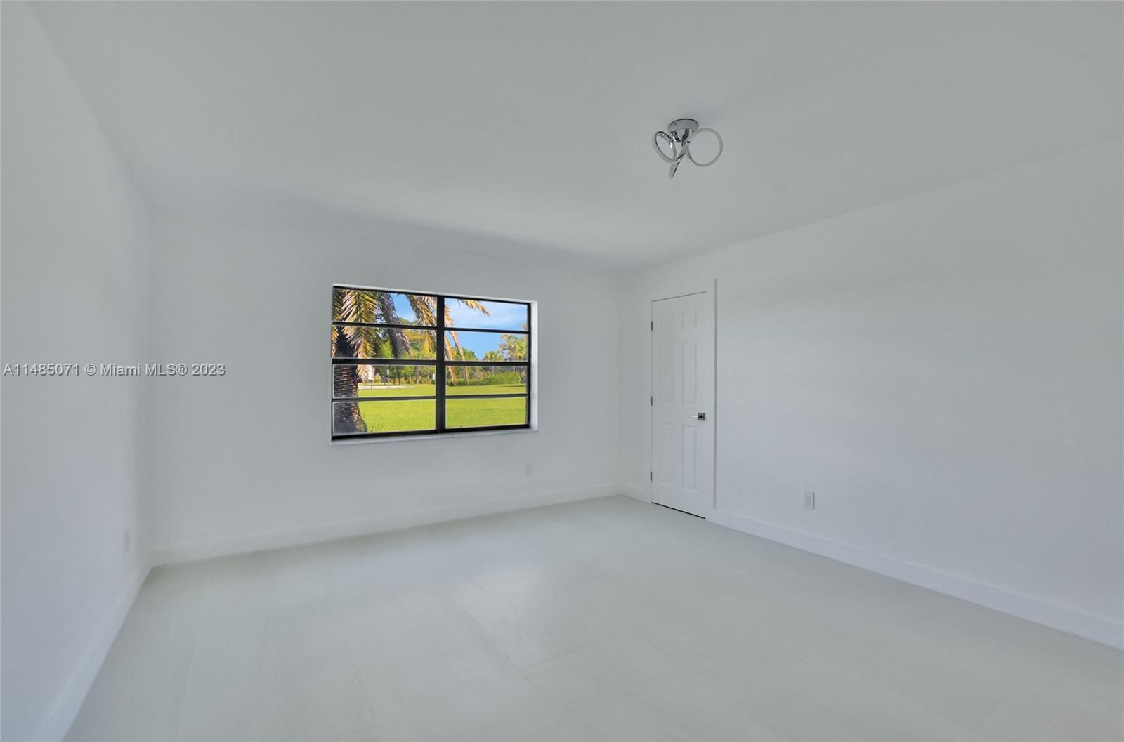 9264 Vista Del Lago, Unit E Boca Raton, FL 33428 - Photo 23 of 26 a view of a room that has a window in it