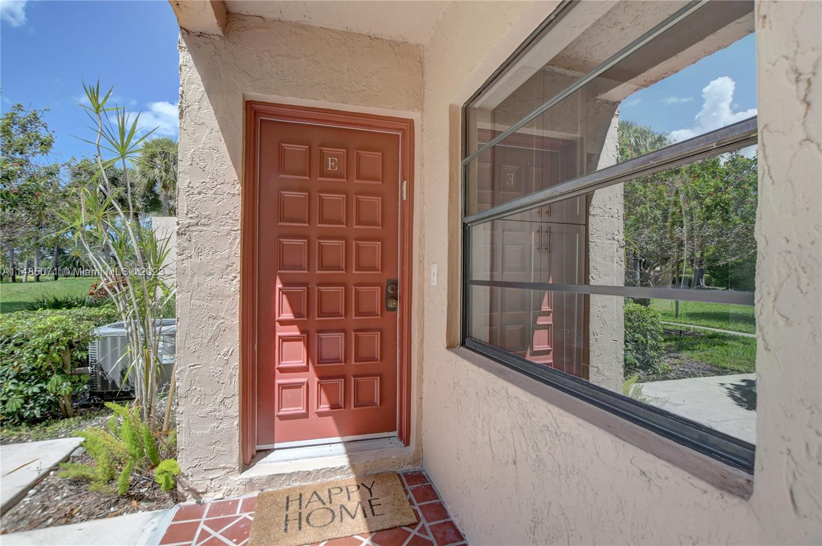 9264 Vista Del Lago, Unit E Boca Raton, FL 33428 - Photo 4 of 26 a view of a door and a window