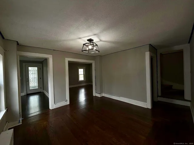 a view of a livingroom with wooden floor