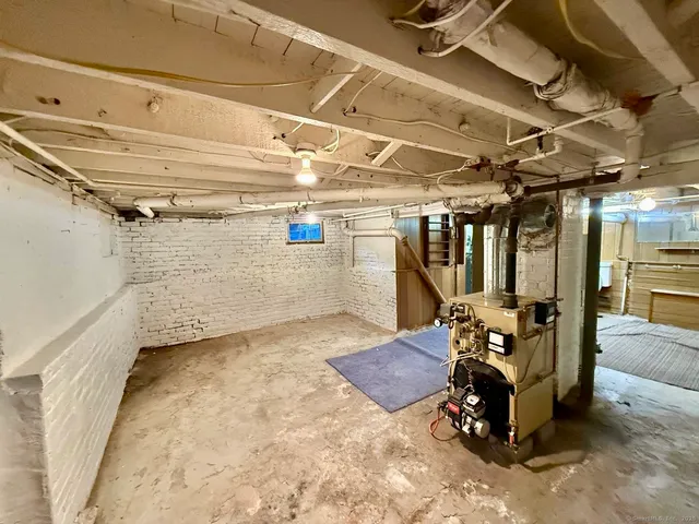 a dining room with furniture and a mirror